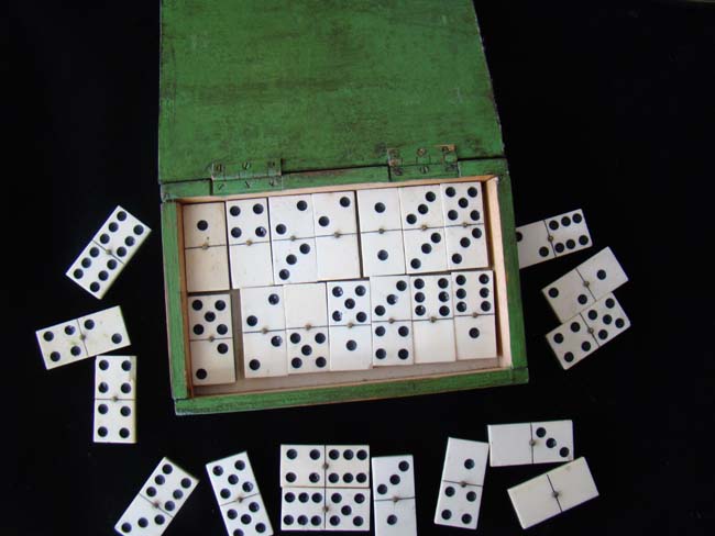 A cased set of 19th century bone and ebony dominoes — image 2